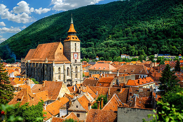 Brasov cityscape with black cathedral and mountain on backround in Romania